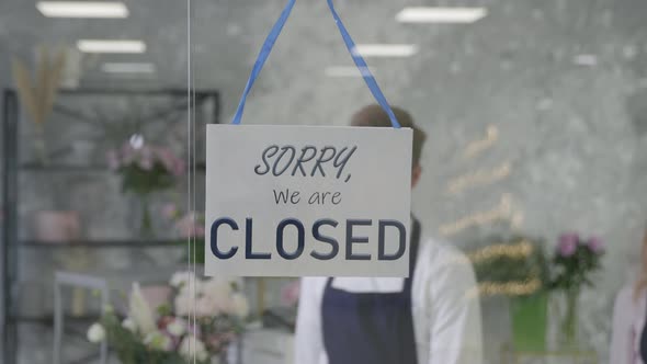 Flower Shop, Successful Happy Entrepreneur Man and Woman Small Business Owners Turn CLOSED Sign Into