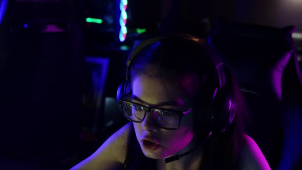 Young Woman Playing an Online Game in Gaming Club