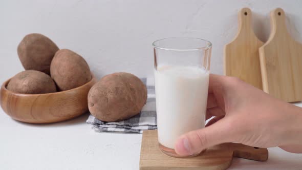 Glass with Potato Milk to the Potato