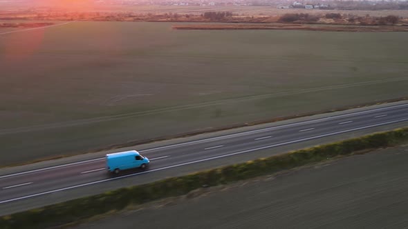 Aerial View of Cargo Van Driving on Highway Hauling Goods