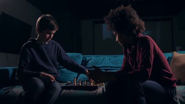 Diverse Teen Chess Players Ending Game at Night