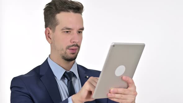 Portrait of Serious Young Businessman Using Tablet, White Background