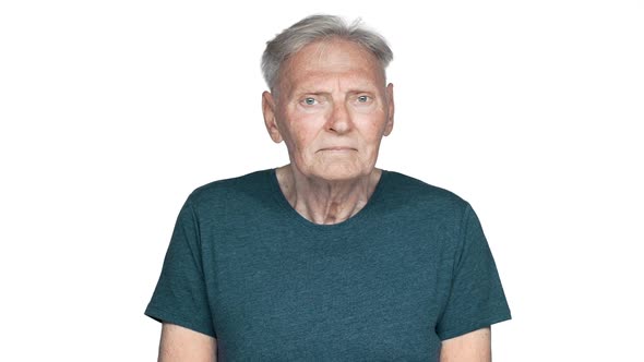 Portrait of Joyful Grandfather 80s Having Gray Hair in Basic Tshirt Turning on you with Glad Smile