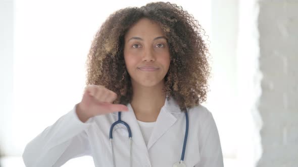 Afrcian Doctor Showing Thumbs Down Sign