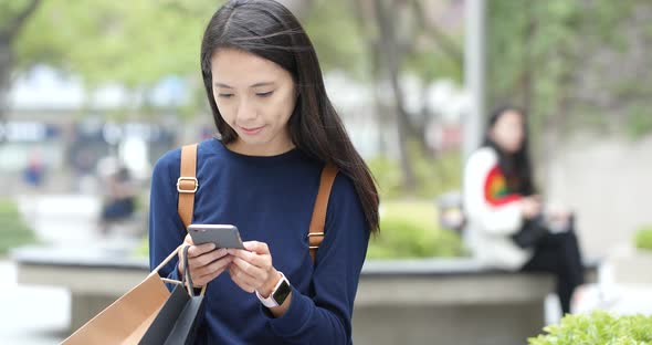 Woman use of cellphone at outdoor