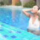 Young asian woman enjoy around outdoor swimming pool for leisure - VideoHive Item for Sale