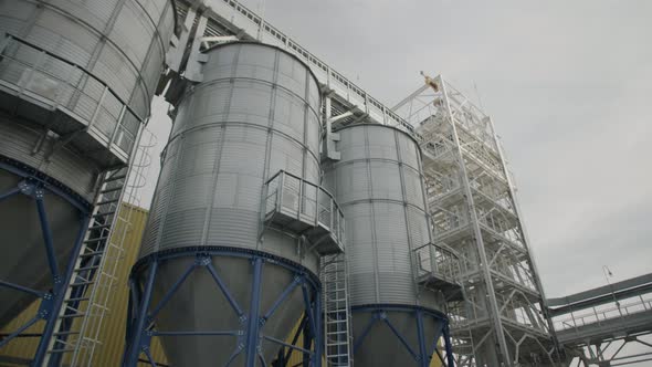 A Line of Steel Grain Silos for Storing Cereal Crops Harvest Hopper Bins Wheat Storage