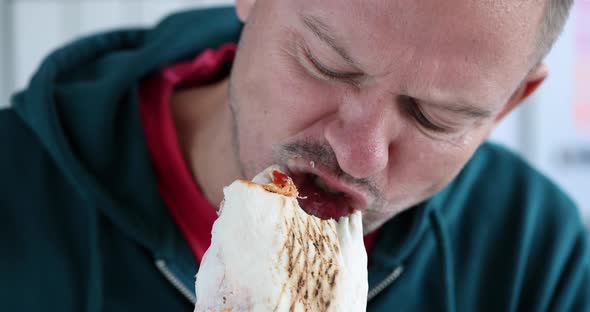 Young Man Eating Delicious Appetizing Shawarma  Movie