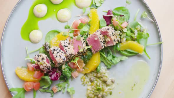 A dish of tuna and salad, top view. In the restaurant