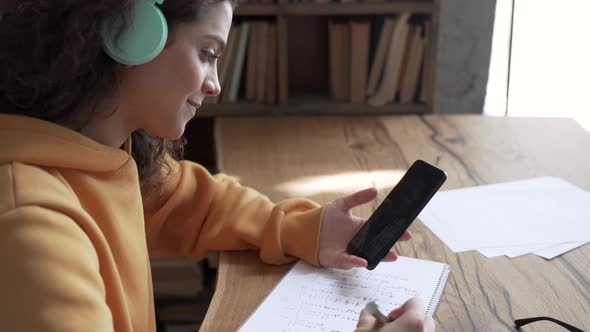 Hispanic Girl School Student Hold Phone Learn Online Video Calling Math Teacher