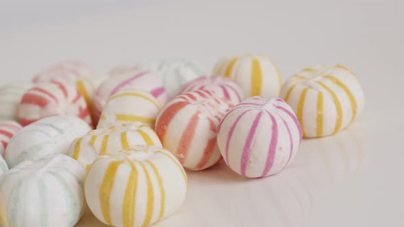 Colorful  round sugar bonbons slow pan 4K video