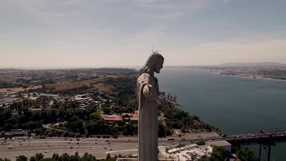 The outstretched arms of Christ the King sanctuary towards the city of Lisbon, Portugal