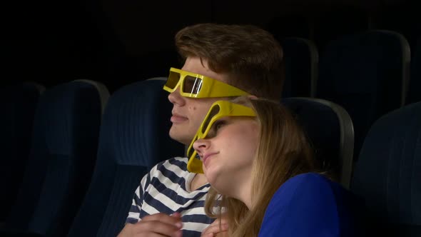Couple in Cinema Watching a Movie with 3D Glasses