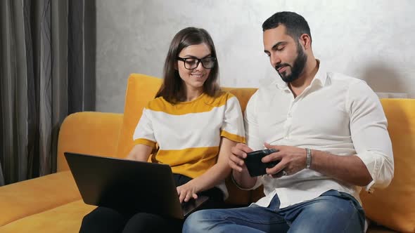 Young Couple Does Online Shopping