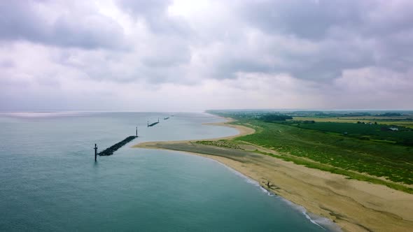 Static aerial landscape of a cloudy stormy day at a beach in England