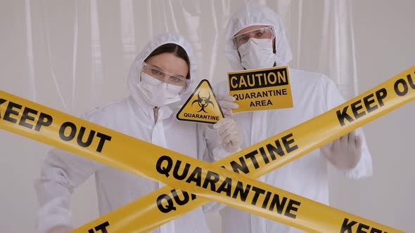 Two Doctors in the Lab in Protective Suits. Quarantine Zone. Coronavirus.