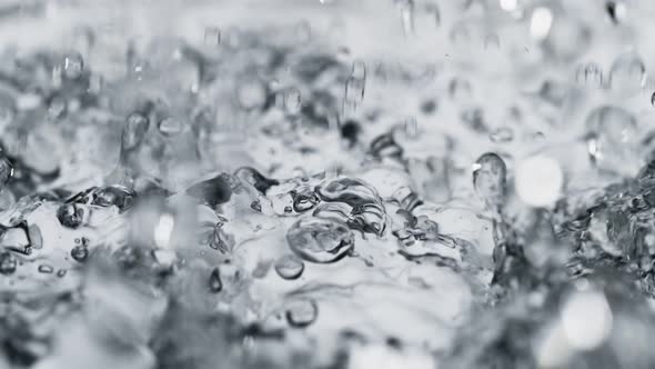 Macro Shot of Rain in Super Slow Motion Shooted with High Speed Cinema Camera at 1000Fps .