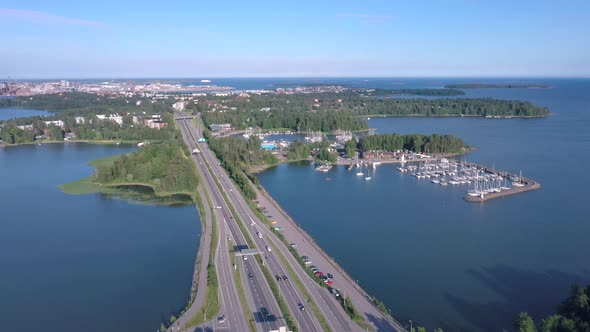 Aerial Shot of the Long Bridge with the Boats Docking on the Side in Helsinki