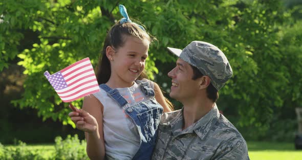 Portrait of soldier with his daughter alt