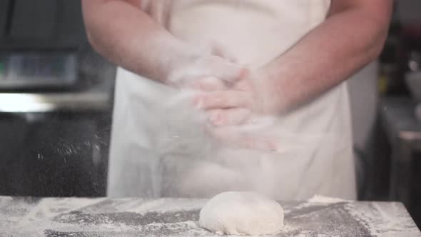 Baker Chef Clapping His Hands Filled with Flour