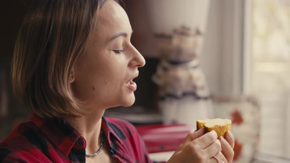 Young Woman Testing Fresh Keto Bread