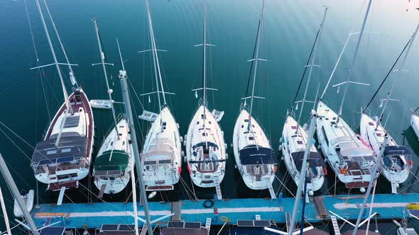 Top down view of yachts in the marina. Sailboats and regular Boats moured