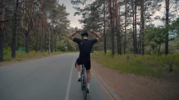 Cycling Men Pedaling Workout Road Bicycle. Fit Cyclist Riding On Road Bike Triathlete Fitness.