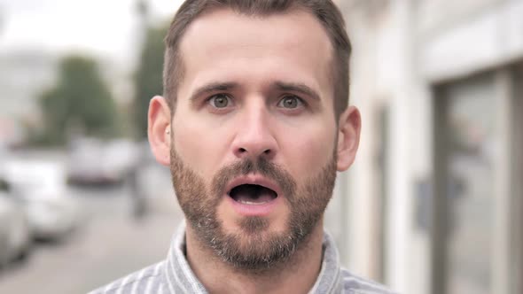 Close Up of Wondering Beard Casual Man Outdoor