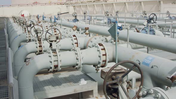 Oil and gas pipes and valves at a large oil refinery