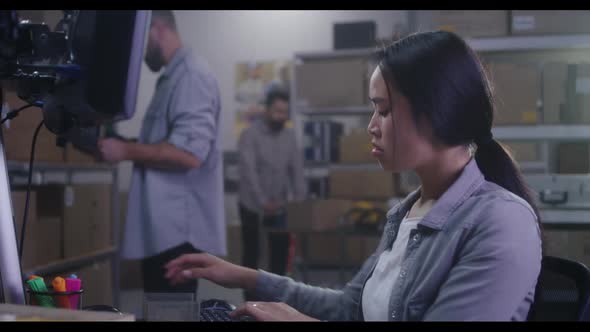 Workers Checking Information on Computer