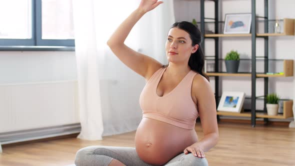 Happy Pregnant Woman Doing Sports at Home