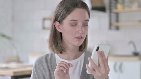 Portrait of Young Woman Get Shock on Smartphone