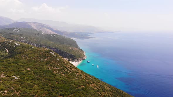 Aerial Drone View of Gjipe Beach and Canyon Dhermi Albania Hidden Paraside with Boats Tourists