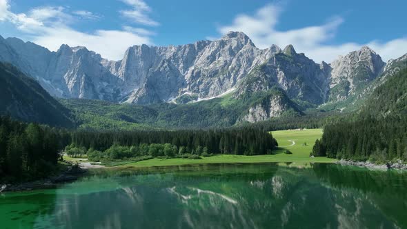 Emerald lake at Fusine with Mangart mountain