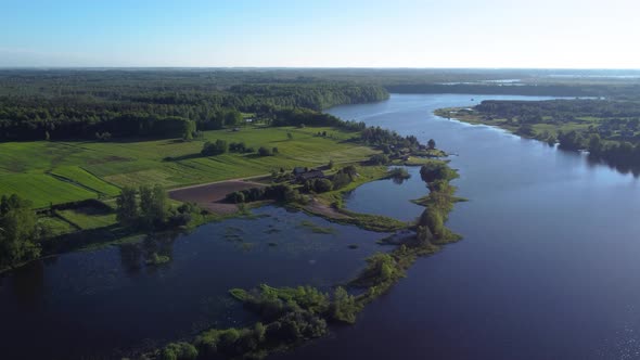 AERIAL Fly-By over a Meandering River and Swampland in Rural Lithuania