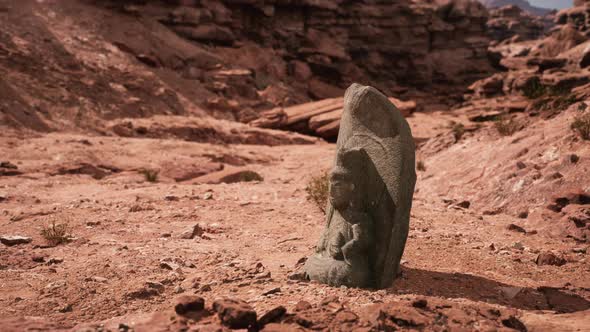 Ancient Statue on the Rocks Desert