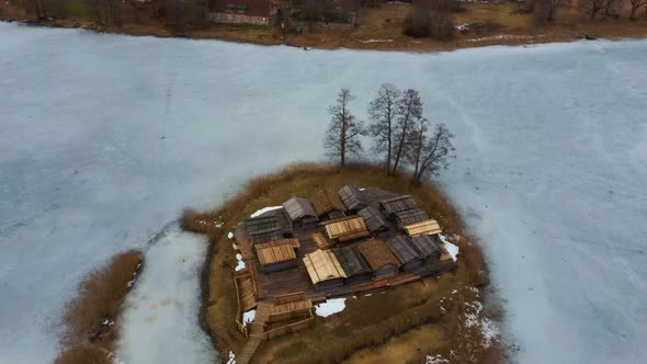 Araisi Lake Castle in Latvia Aerial Shot From Above. Historical Wooden Buildings on Small Island in
