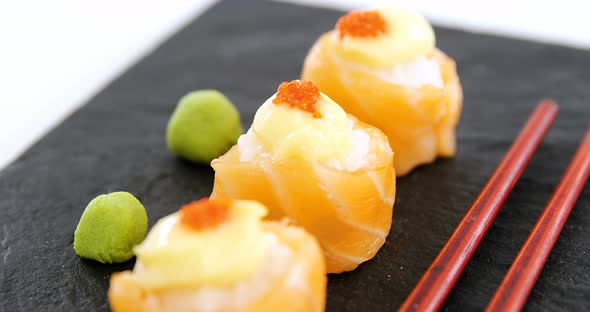 Sushi served on tray with chopsticks