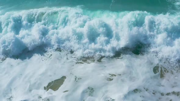 Low Flight Over the Sandy Beach and Waves