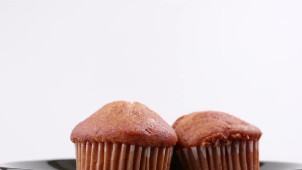 Muffins banana with white background shallow focus and slowly rotating.