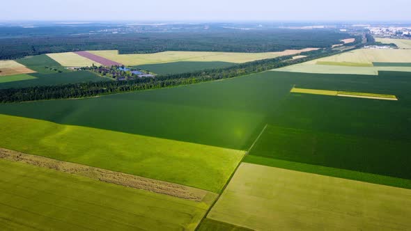 Aerial Drone View Flight Over Different Agricultural Fields Sown