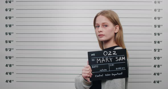 Side Profile Mugshot of Female Person with Blond Hair Turning Head and Looking to Camera