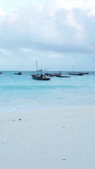Boat Boats in the Ocean Near the Coast of Zanzibar Tanzania Slow Motion Vertical Video