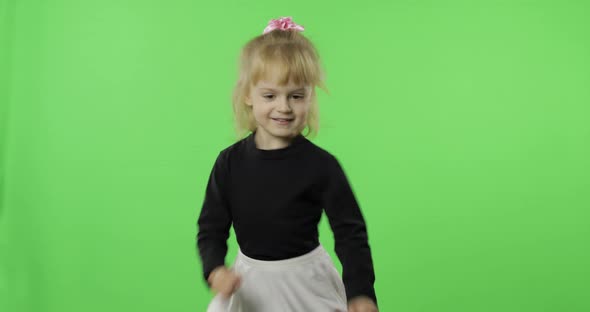 Girl in Black and White Dress Dancing. Happy Four Years Old Child. Chroma Key