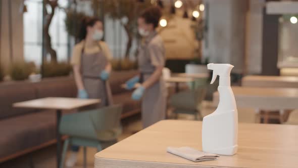 Sprayer with Disinfectant on Cafe Table