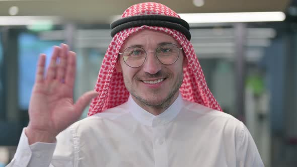Middle Aged Arab Man Waving, Welcoming