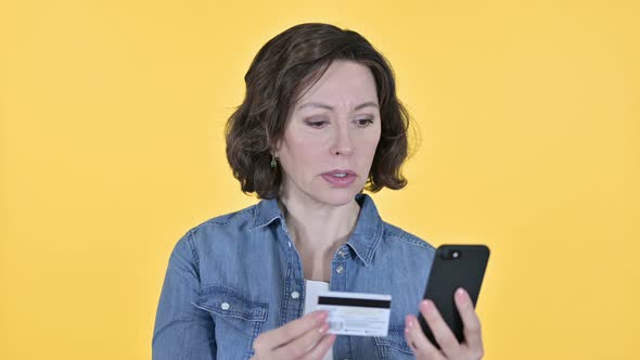 Online Payment on Smartphone By Old Woman, Yellow Background 