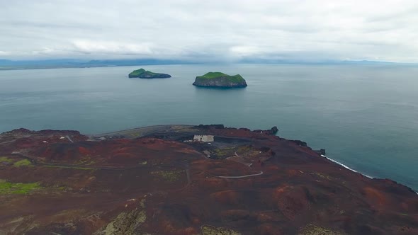 Flying over Eldfell volcano on Heimaey island (Westman Islands) in Iceland