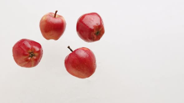 Red Apples Jump and Fall Natural Fruits Isolated on White Background