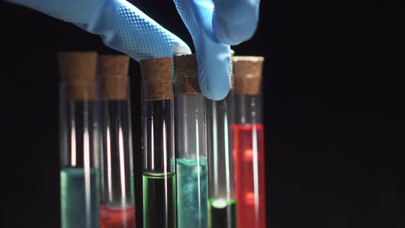 Lab Technician Opens a Test Tube with Boiling Liquid, Close-up of a Hand